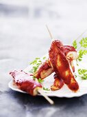 Spicy chicken satay skewers with chervil