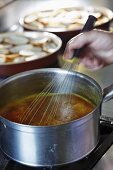 Sopa grassa (thick bread soup, Savoy) being made