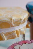 Jars of jam with covers upcycled from oilcloth remnants and ribbons