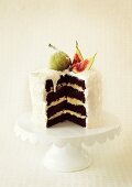 A coconut cake with fresh figs, sliced