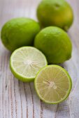 Limes on a lightwooden surface