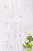Limes on a white wooden table
