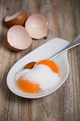 Egg yolks with sugar (ingredients for vanilla pudding)