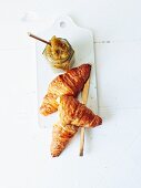 Kiwi jam with vanilla and croissants