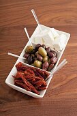 Dried tomatoes, olives and sheep's cheese as antipasti