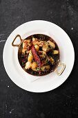Squid with potatoes, olives and capers