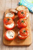 Grilled tomatoes filled with goat's cheese and rosemary