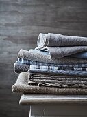 Folded and stacked cloths in natural fabrics (linen, cotton)
