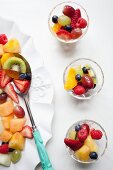 Fruit salad with strawberries, pineapple, kiwi, oranges and raspberries