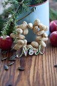 Hand-made wreath of peanuts for feeding birds