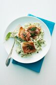 Fish saltimbocca on a bed of rice