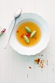 Tomato consomme with basil dumplings