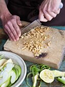 Waldorf salad being made: nuts being chopped