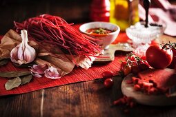 Red pasta with tomato sauce and ingredients