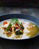 Colourful vegetable soup with dill