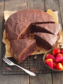 Chocolate cake topped with strawberries