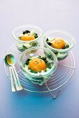 Eggs in jars with spinach