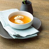Tomato consomme with basil dumplings