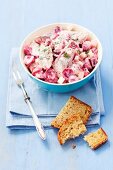 Herring salad with beetroot, apple, red onions and mayonnaise