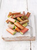 Pieces of rhubarb on a wooden board