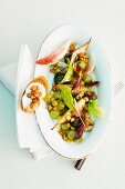 An autumnal salad with grapes and walnuts