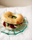 Bagel filled with beetroot and soft cheese for an autumnal breakfast