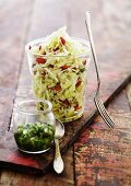 White cabbage salad in a jar with goji berries