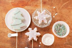 Christmas tree and snowflake-shaped biscuits on sticks