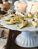 Halloumi skewers with pears and chopped almonds