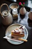 A slice of ricotta almond cake with plums