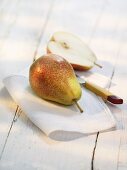 Pears on a cloth with a knife