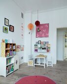 Child's bedroom with shelves, small table and bench