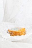 French blue-veined cheese on a piece of parchment paper