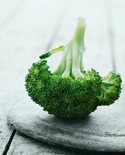 Broccoli on a wooden plate