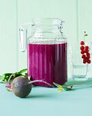 A smoothie made with beetroot, berries and orange