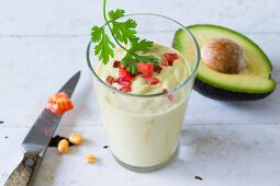 An avocado smoothie with kefir and diced tomatoes