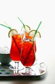 Iced tea with lemon wedges and straws