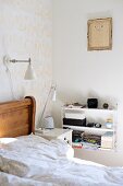 Wooden bed, bedside cabinet, full, white String shelves and child's drawing in gilt frame