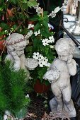 Stone statues and white flowers