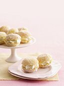 Mini lemon jelly cakes filled with cream and grated coconut