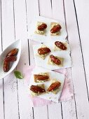 Crackers with olive mousse and spicy dates