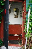 View into privy in wooden hut