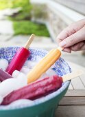 Various different coloured ice lollies