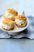 Spicy profiteroles filled with a Gorgonzola and lemon cream