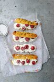 Eclairs with raspberries