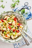 Pasta with kiwi, tomatoes and Greek basil