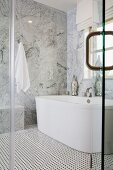 View of bathtub through closed glass door; Irvine; California; USA