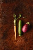 A carrot, a courgette and an aubergine