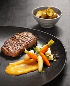 Beef steak with carrots, asparagus and potatoes