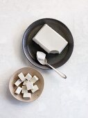 A block of tofu and diced tofu